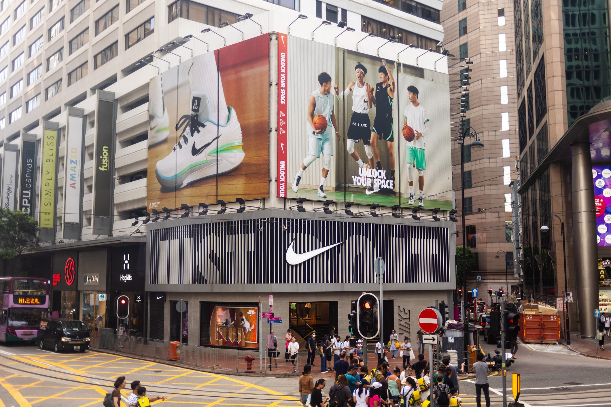 Nike storefront on a busy street in Hong Kong demonstrating their universal marketing message.